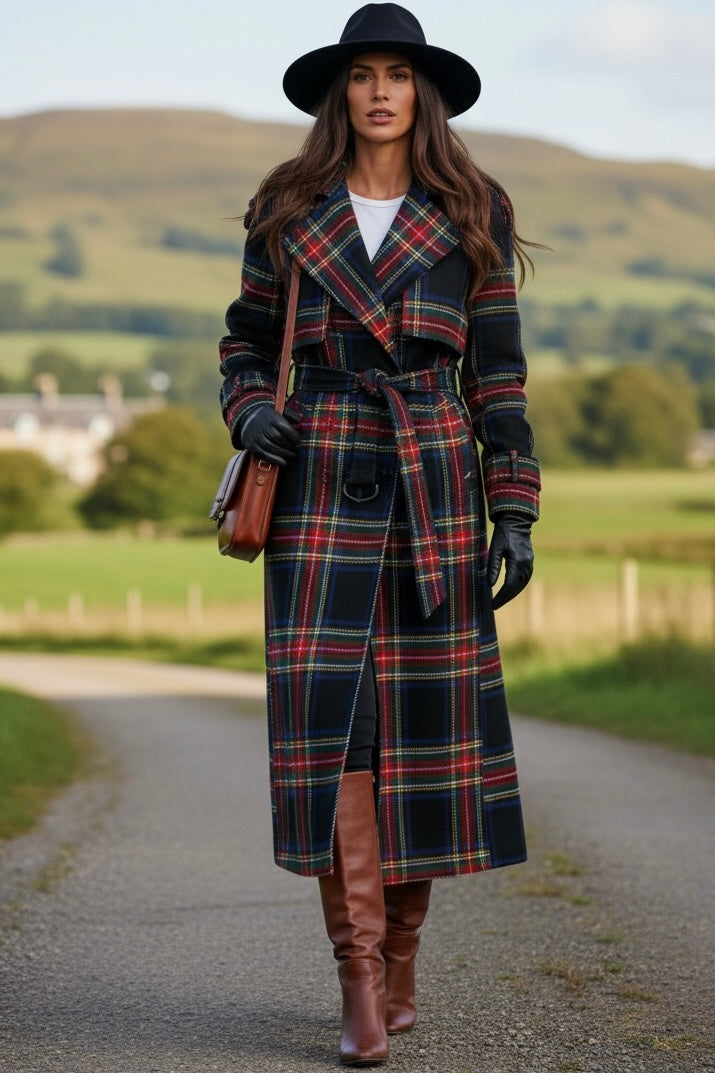 Woman wearing women's tartan trench coat with belt, paired with black hat and brown boots outdoors