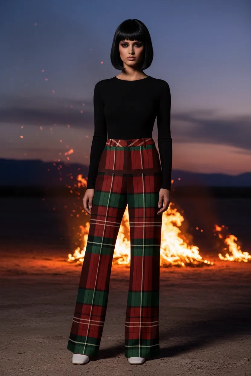 Woman wearing burgundy green tartan trousers women with high waist and wide legs near fire at dusk