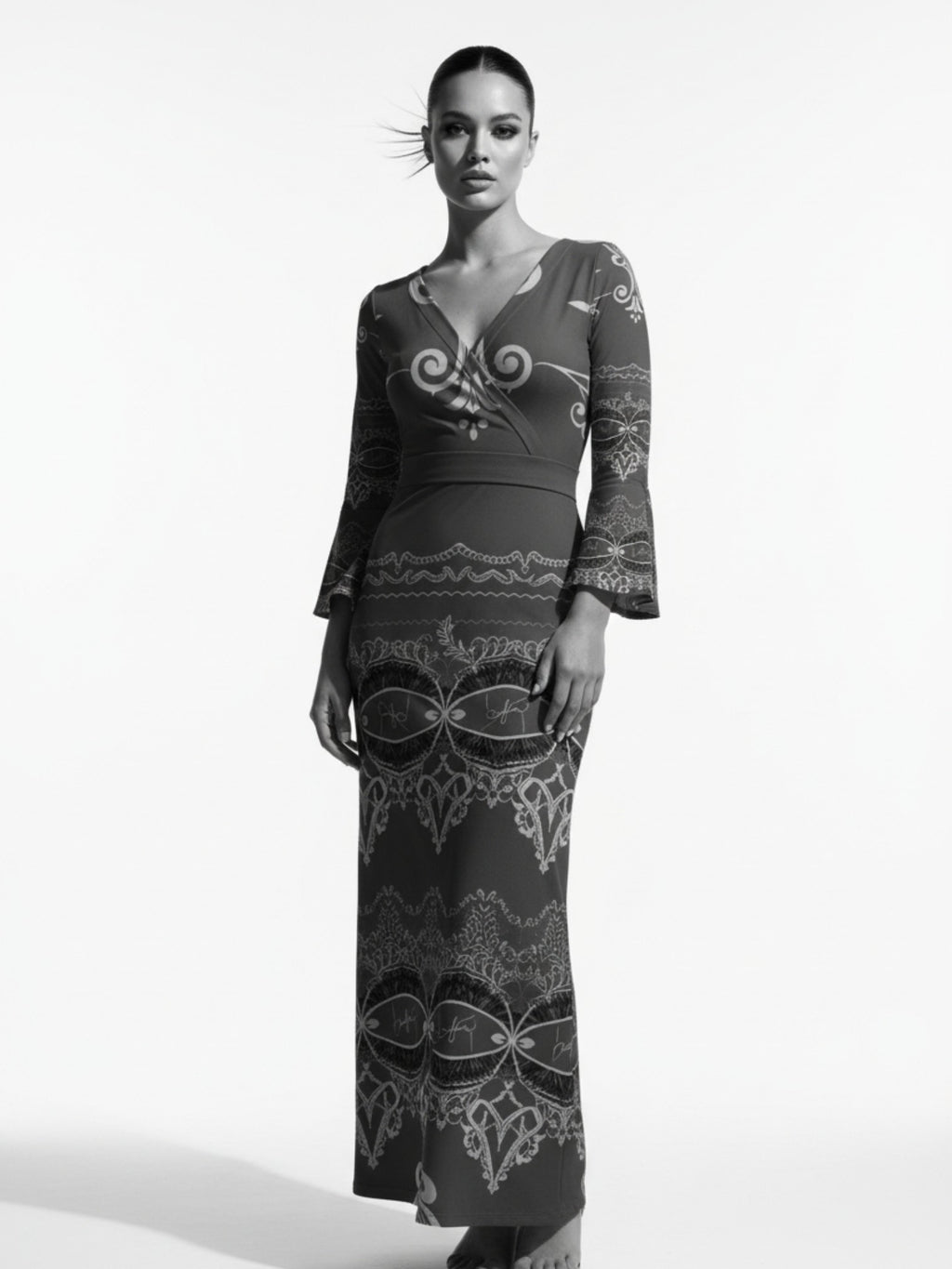 Woman wearing a long sleeve v-neck evening gown maxi dress with intricate patterns from Angelic Blessings Shop