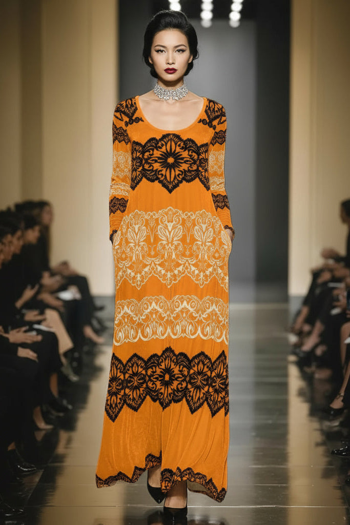 AWomen’s long-sleeve gold velvet evening gown with heritage baroque lace detailing.